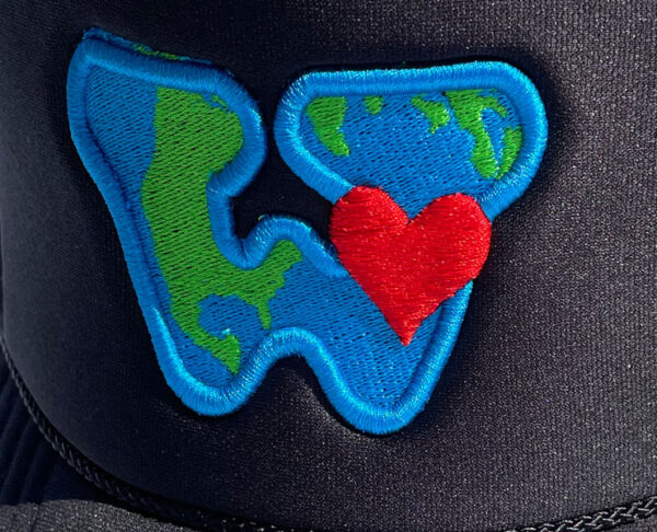Black polyester foam We Are Put On Earth To Love trucker hat